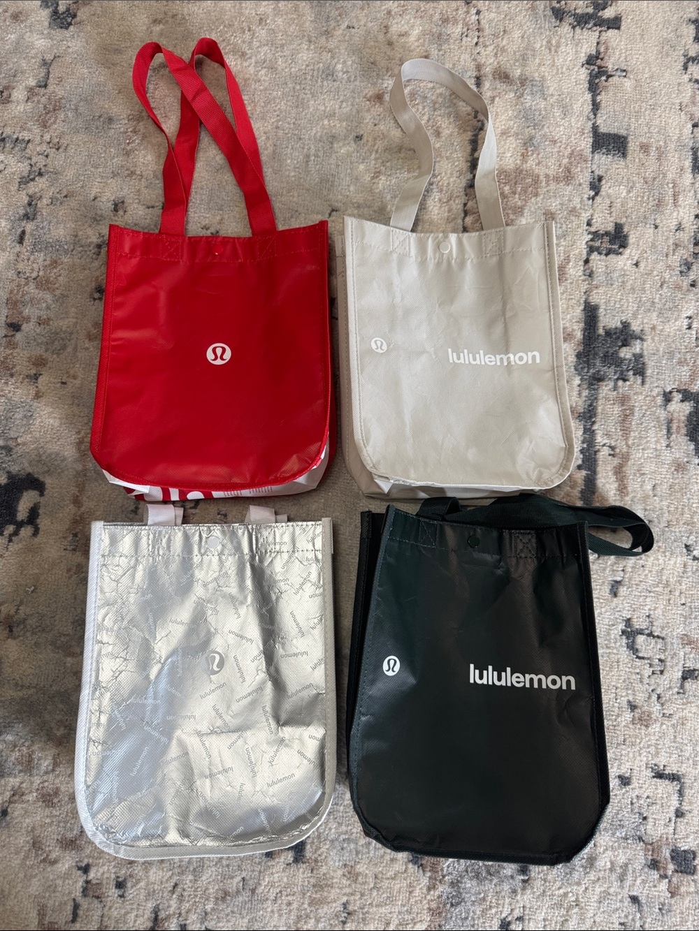 4 small lululemon shopping bags